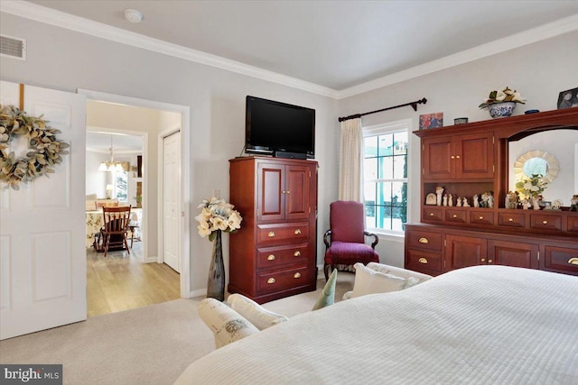 bedroom with light colored carpet, a chandelier, and ornamental molding