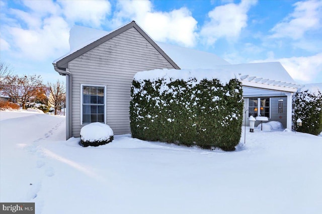 view of snow covered property