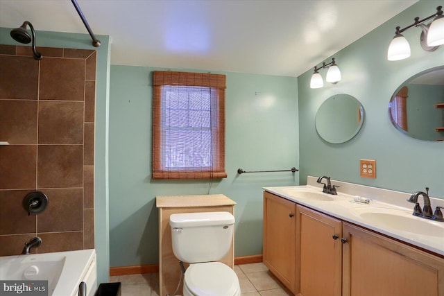 full bathroom with vanity, toilet, tiled shower / bath combo, and tile patterned flooring