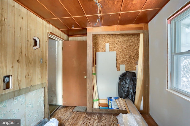 misc room featuring wood ceiling, wooden walls, and wood-type flooring