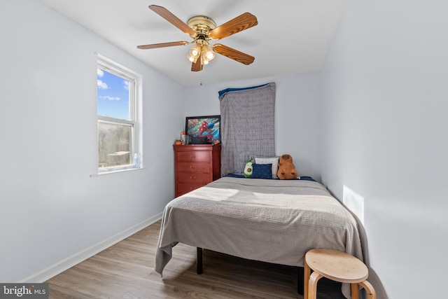 bedroom featuring light hardwood / wood-style floors and ceiling fan