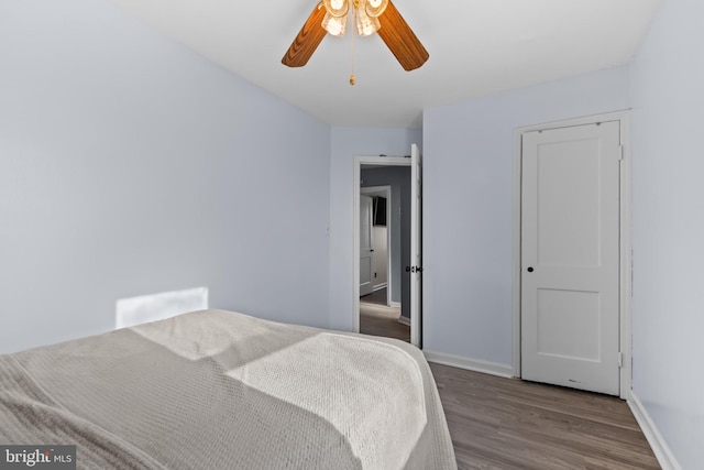 bedroom featuring ceiling fan and hardwood / wood-style flooring