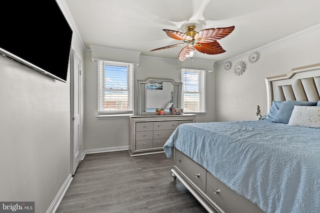 bedroom with ceiling fan, dark hardwood / wood-style flooring, and ornamental molding