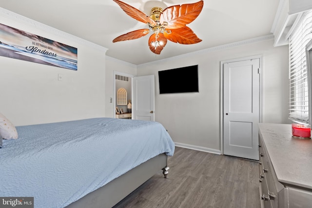 bedroom with ceiling fan, light hardwood / wood-style flooring, crown molding, and multiple windows