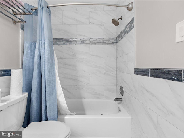 bathroom featuring toilet and shower / bath combo with shower curtain