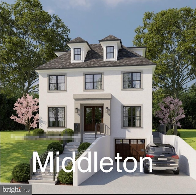 view of front of house with french doors, an attached garage, and a front lawn