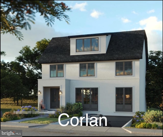 view of front of home featuring roof with shingles and stucco siding