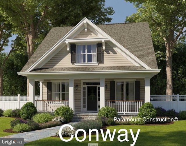 view of front of house featuring a porch, a front lawn, and fence