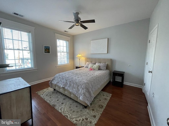 bedroom featuring ceiling fan and dark hardwood / wood-style floors