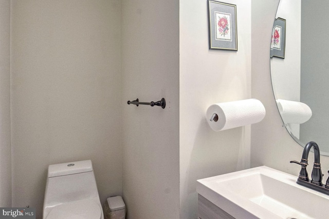 bathroom with vanity and toilet