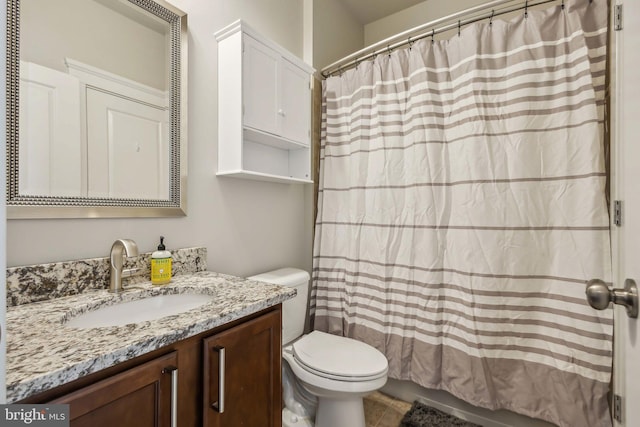 bathroom featuring vanity, a shower with curtain, and toilet