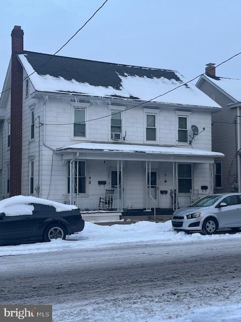 view of front of home featuring covered porch