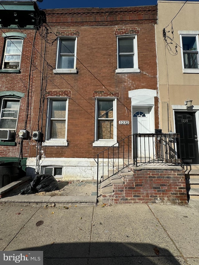 view of property featuring central AC unit