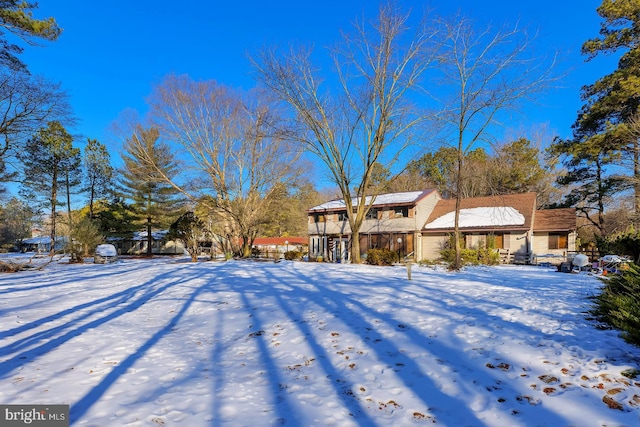 view of yard layered in snow