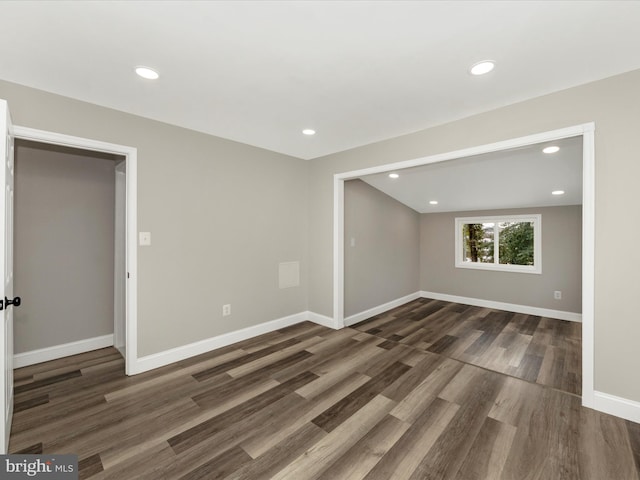 unfurnished room featuring dark wood-type flooring