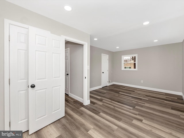 spare room featuring hardwood / wood-style floors