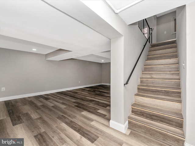 stairway featuring hardwood / wood-style flooring