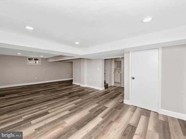 basement featuring dark hardwood / wood-style floors