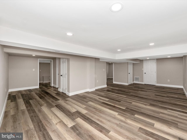 basement with dark wood-type flooring