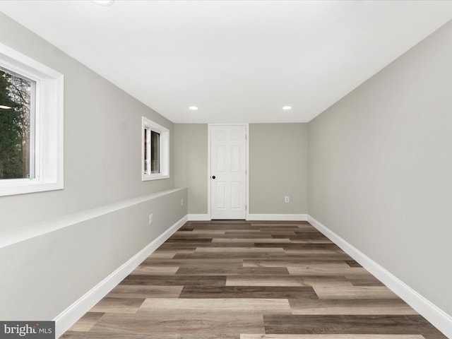 spare room with dark hardwood / wood-style flooring