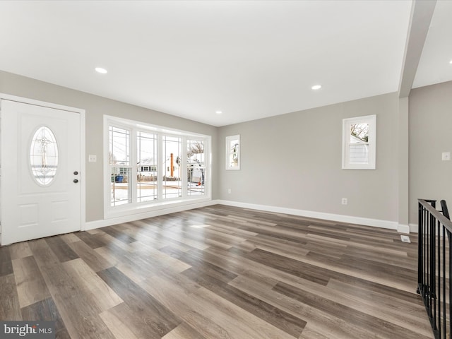 entrance foyer featuring a wealth of natural light and hardwood / wood-style floors