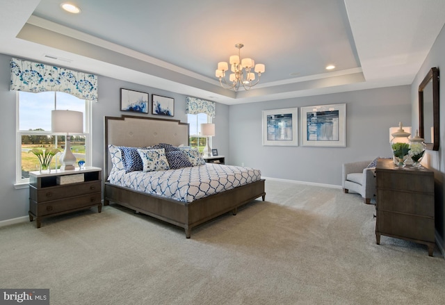 bedroom with light carpet, an inviting chandelier, and a tray ceiling