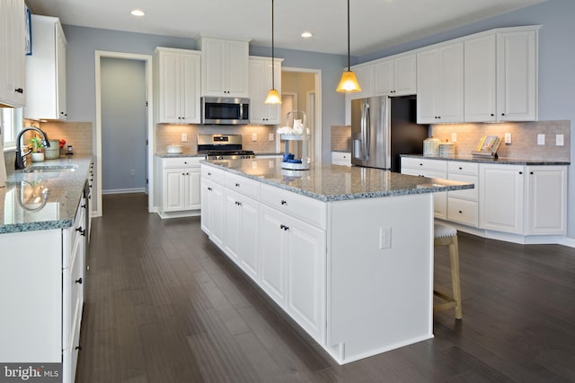 kitchen featuring sink, white cabinets, and appliances with stainless steel finishes