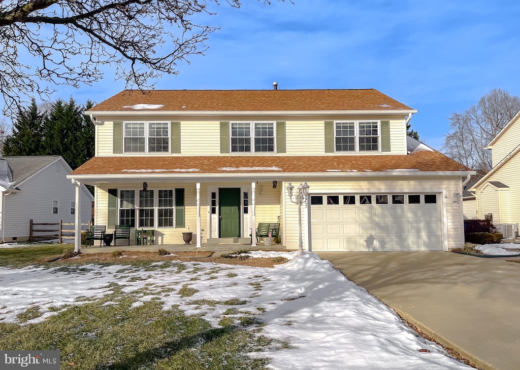 view of front of house featuring covered porch and a garage