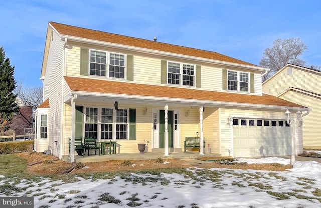 view of front of home featuring a garage and covered porch