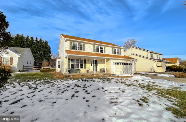 view of front property with a garage and covered porch