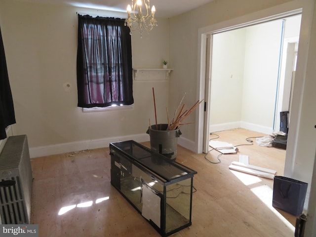 interior space featuring heating unit and an inviting chandelier