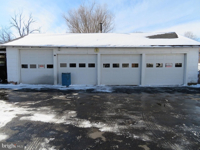 view of snow covered garage