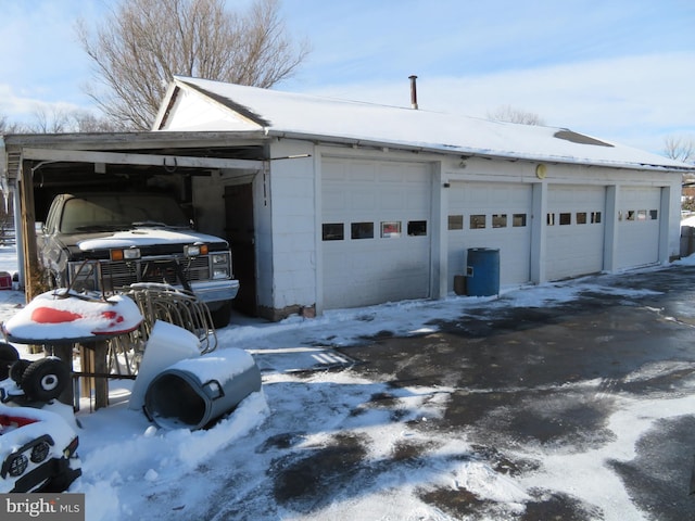 view of snow covered garage