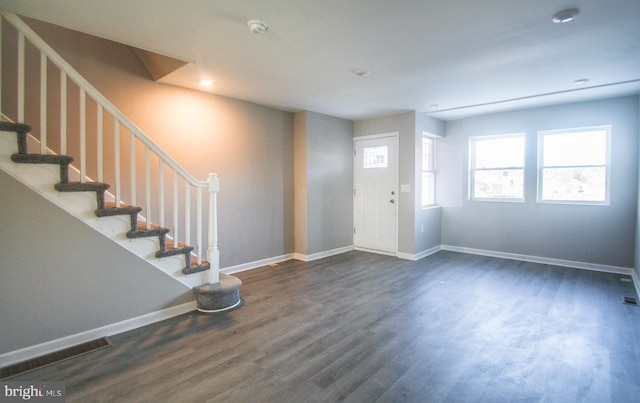 foyer with dark hardwood / wood-style floors