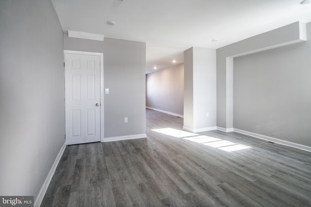 spare room featuring dark hardwood / wood-style floors