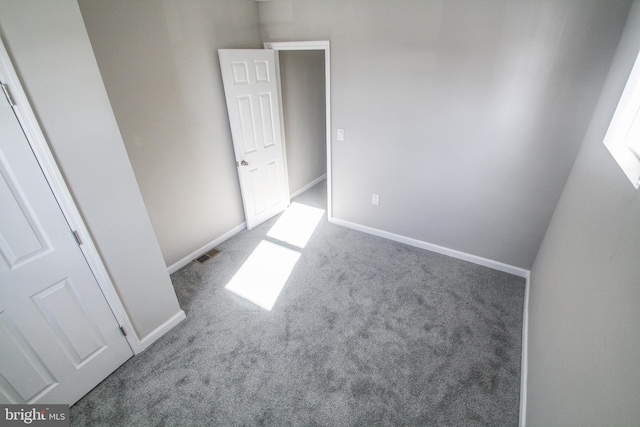 empty room with light colored carpet