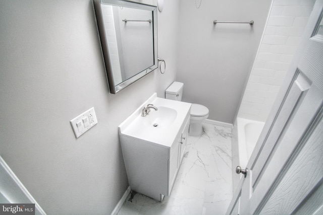 bathroom with toilet and vanity