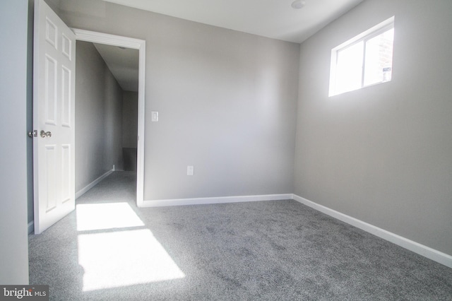 unfurnished room with carpet flooring