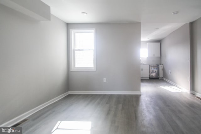 empty room featuring dark wood-type flooring