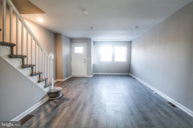 foyer entrance with dark hardwood / wood-style flooring