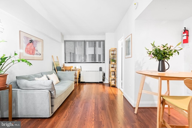 living room featuring radiator and dark wood-type flooring