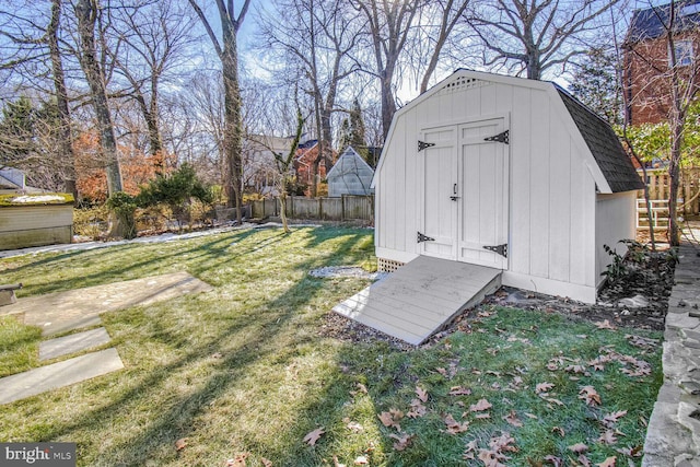 view of outdoor structure featuring a lawn