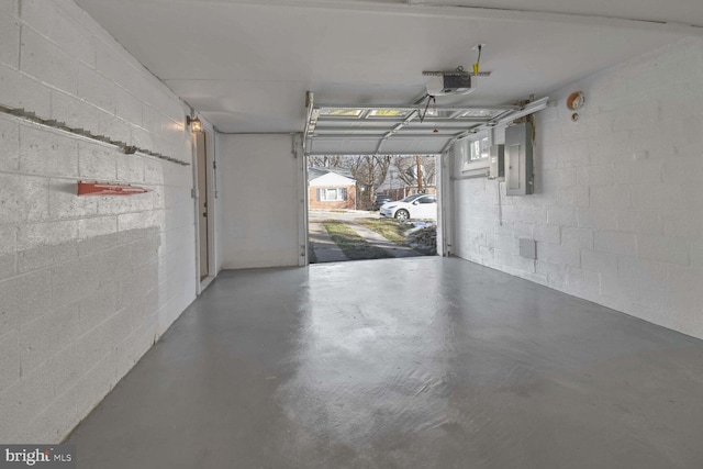 garage featuring a garage door opener and electric panel