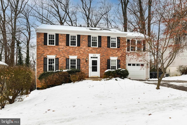 colonial inspired home featuring a garage