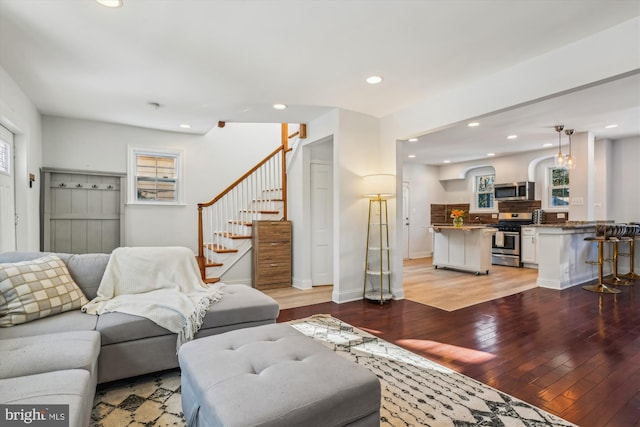 living room featuring a wealth of natural light and light wood-type flooring