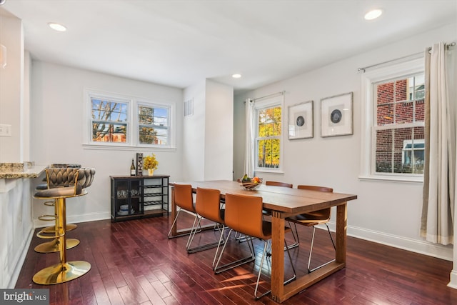 dining room with dark hardwood / wood-style floors