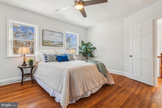 bedroom with hardwood / wood-style flooring and ceiling fan