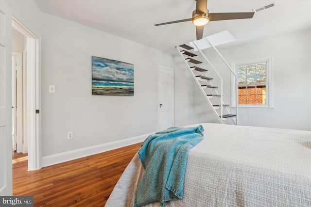 bedroom featuring hardwood / wood-style flooring and ceiling fan