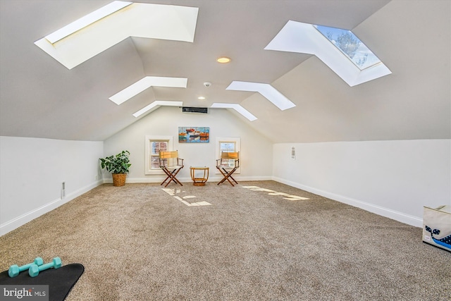 additional living space with vaulted ceiling and carpet