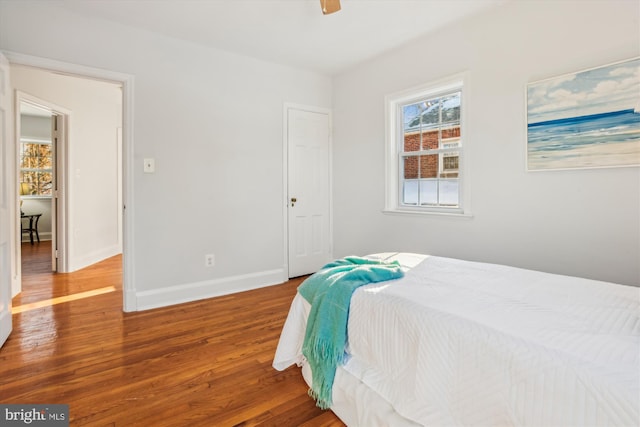 bedroom featuring hardwood / wood-style floors and ceiling fan